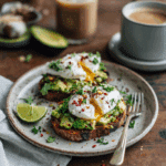 “Finished Air Fryer Garlic Avocado Toast with poached egg and chili flakes served on a ceramic plate”