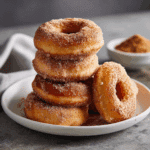 Air Fryer Uncrustable Donuts coated in cinnamon sugar, ready to serve.