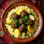 “Plated Air Fryer Golden Moroccan Meatballs on couscous with parsley and lemon, styled for a Moroccan-inspired dinner”